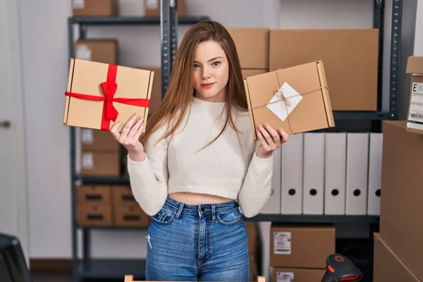 Young Caucasian Woman Working Small Business Ecommerce Relaxed Serious Expression — Zdjęcie stockowe