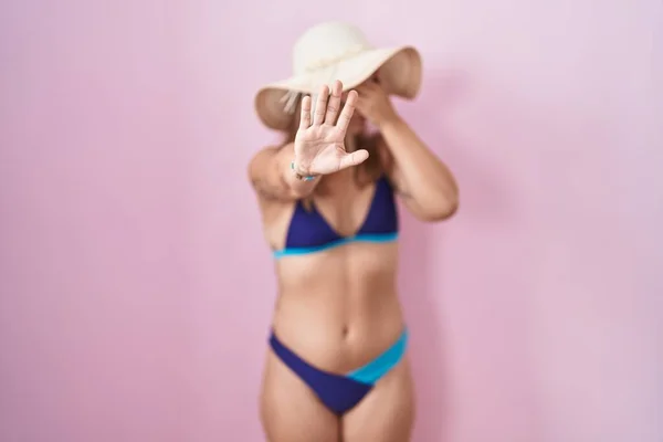 Young Hispanic Woman Wearing Bikini Pink Background Covering Eyes Hands — Stock Photo, Image