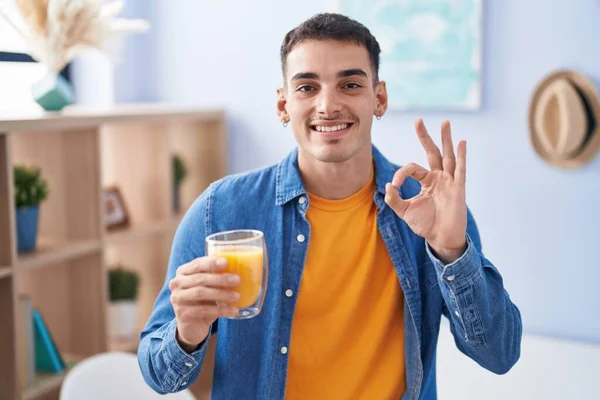 Handsome Hispanic Man Drinking Glass Orange Juice Doing Sign Fingers — Stock Photo, Image