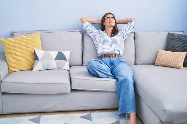 Young Woman Relaxed Hands Head Sitting Sofa Home — Fotografia de Stock
