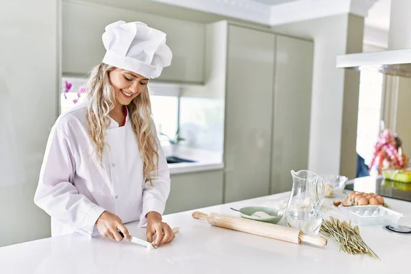 Young Woman Wearing Cook Uniform Cutting Dough Kitchen — ストック写真