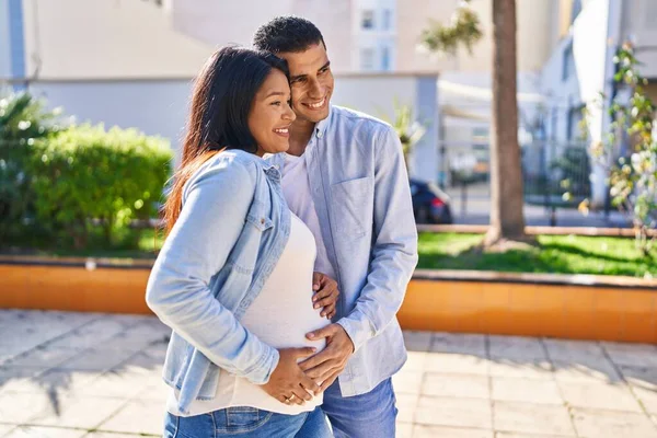 Young Latin Couple Expecting Baby Hugging Each Other Standing Park — Stockfoto