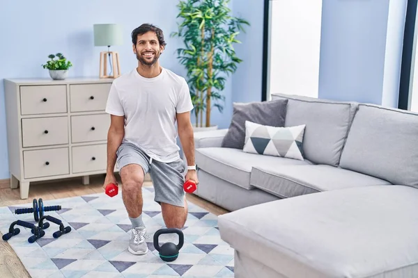 Young Hispanic Man Smiling Confident Using Dumbbells Training Home — Foto Stock