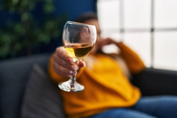 stock image Young beautiful plus size woman drinking wine sitting on sofa at home