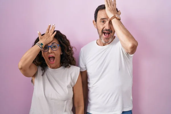 Middle Age Hispanic Couple Together Pink Background Surprised Hand Head — Stock Photo, Image