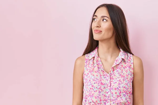 Young Hispanic Woman Long Hair Standing Pink Background Smiling Looking — стоковое фото