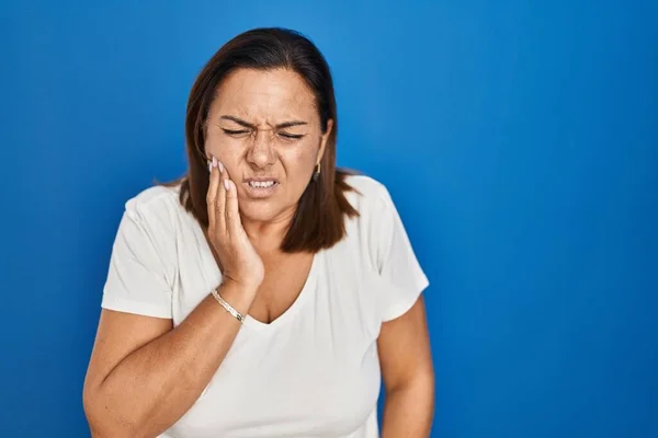 Hispanic Mature Woman Standing Blue Background Touching Mouth Hand Painful — Stock Photo, Image