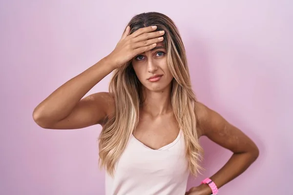 Young Blonde Woman Standing Pink Background Worried Stressed Problem Hand — Foto Stock