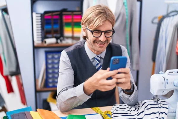 Young Blond Man Tailor Smiling Confident Using Smartphone Clothing Factory — Stock Photo, Image