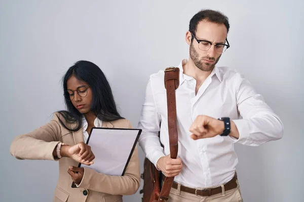 Interracial Business Couple Wearing Glasses Checking Time Wrist Watch Relaxed — Stock Photo, Image