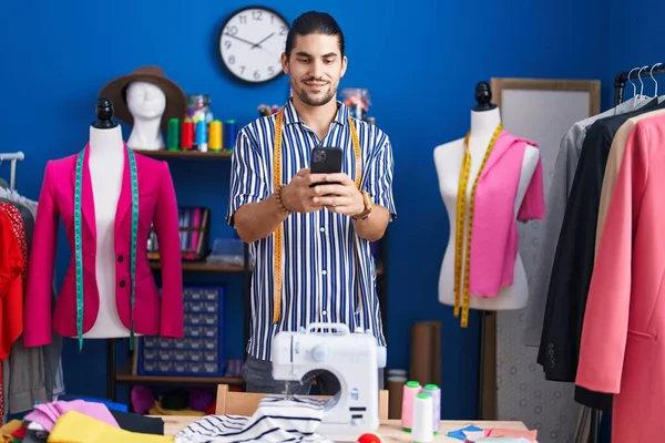 Young Hispanic Man Tailor Smiling Confident Using Smartphone Sewing Studio — Photo