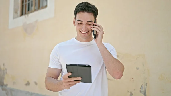 Young Hispanic Man Talking Smartphone Using Touchpad Street — Stock Photo, Image