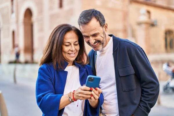 Middle Age Man Woman Couple Using Smartphone Standing Together Street — Stok fotoğraf