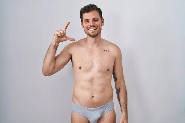 Young Hispanic Man Standing Shirtless Wearing Underware Smiling Confident Gesturing — Stock Photo, Image