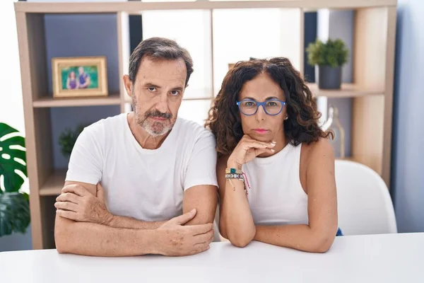 Man Woman Couple Sitting Table Serious Expression Home — Stock Photo, Image