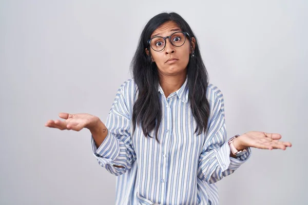 Young Hispanic Woman Wearing Glasses Clueless Confused Open Arms Idea — Stock Photo, Image