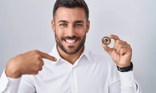 Handsome Hispanic Man Holding Polkadot Cryptocurrency Coin Pointing Finger One — Stock Photo, Image