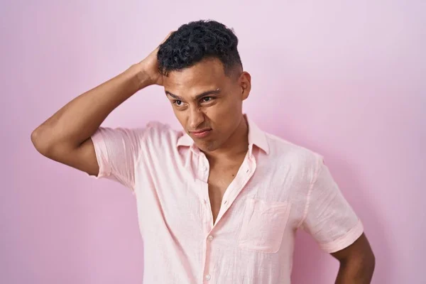 Young Hispanic Man Standing Pink Background Confuse Wondering Question Uncertain — Stock Photo, Image