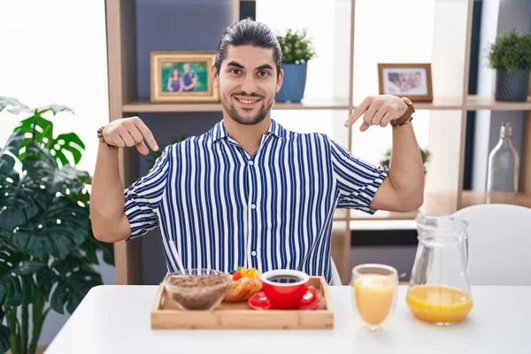 Hispanic Man Long Hair Sitting Table Having Breakfast Looking Confident — Stock Photo, Image