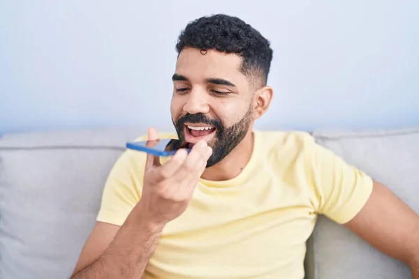 Young Arab Man Talking Smartphone Sitting Sofa Home — Foto de Stock