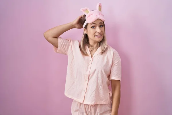Blonde Caucasian Woman Wearing Sleep Mask Pajama Confuse Wondering Question — Stock Photo, Image