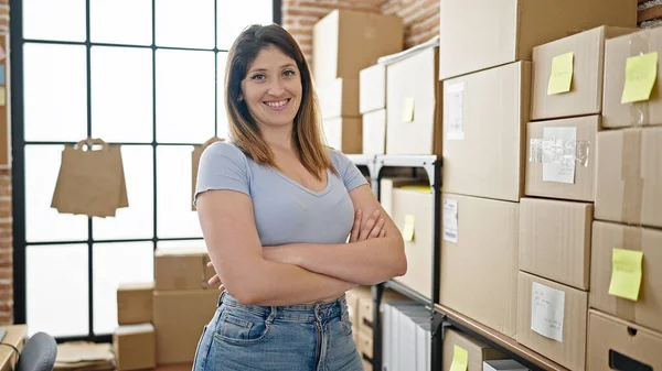 Young blonde woman ecommerce business worker standing with arms crossed gesture smiling at office