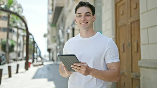 Young Hispanic Man Smiling Confident Using Touchpad Street —  Fotos de Stock