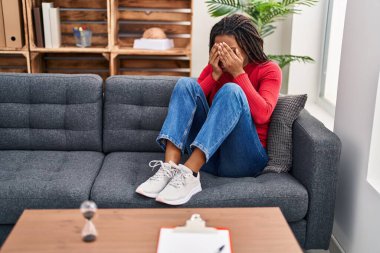 African american woman stressed patient having psychology session at psychology center