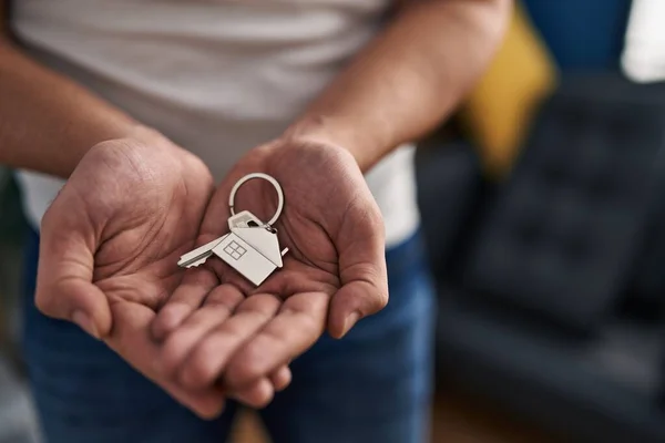 Young Hispanic Man Holding Key New Home — Stockfoto
