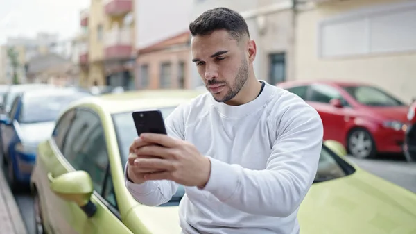 Young Hispanic Man Using Smartphone Sitting Car Street — 스톡 사진