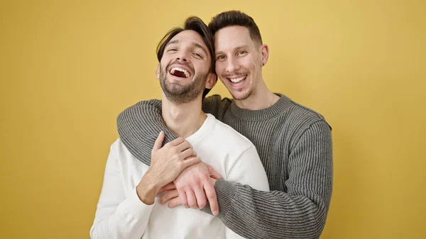 Two Men Couple Hugging Each Other Standing Isolated Yellow Background — Stock Photo, Image