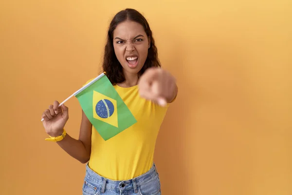 Young Hispanic Woman Holding Brazil Flag Pointing Displeased Frustrated Camera — Stock Photo, Image