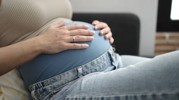 Young Pregnant Woman Touching Belly Sitting Sofa Home — Stock Fotó