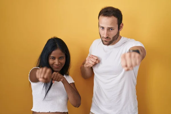Interracial Couple Standing Yellow Background Punching Fist Fight Aggressive Angry — Stock Photo, Image