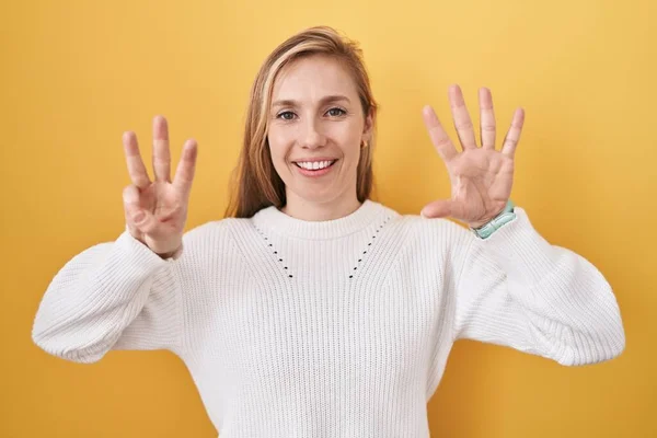 Young Caucasian Woman Wearing White Sweater Yellow Background Showing Pointing — Stock Photo, Image