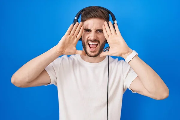 Hispanic Man Beard Listening Music Wearing Headphones Smiling Cheerful Playing — стокове фото