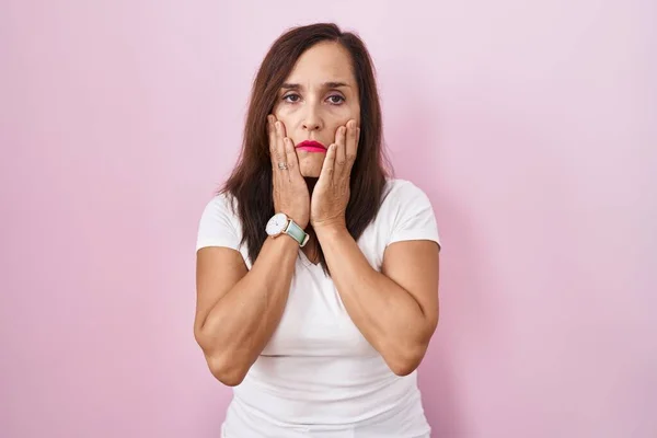 Middle Age Brunette Woman Standing Pink Background Tired Hands Covering — Stock Photo, Image