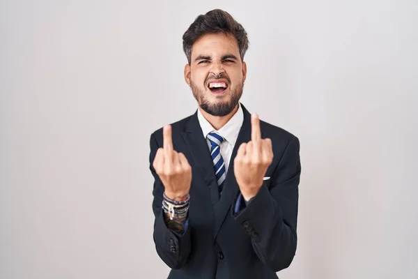 Young Hispanic Man Tattoos Wearing Business Suit Tie Showing Middle — Foto Stock