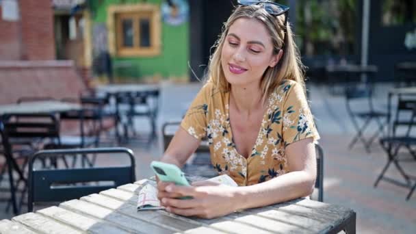 Young Blonde Woman Smiling Confident Using Smartphone Coffee Shop Terrace — Wideo stockowe