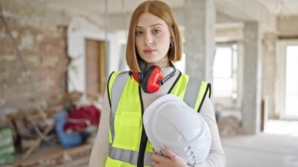 Young Blonde Woman Architect Standing Relaxed Expression Holding Hardhat Construction — Stock Video