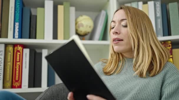 Young Blonde Woman Student Reading Book Library University — Video