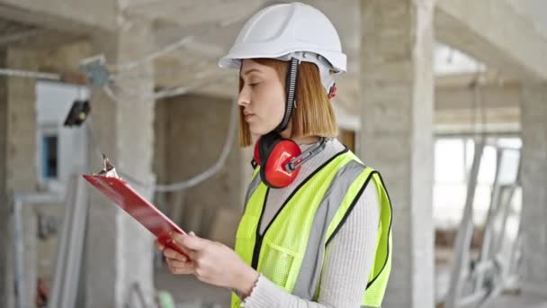Young Blonde Woman Architect Reading Document Construction Site — Stock Video