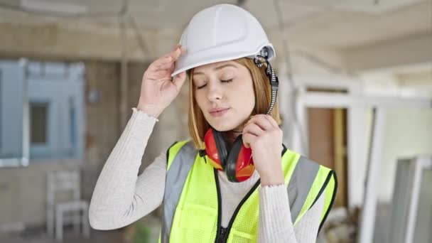 Young Blonde Woman Architect Smiling Confident Taking Out Hardhat Construction — Stock Video