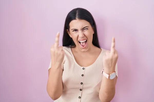 Young Hispanic Woman Standing Pink Background Showing Middle Finger Doing — Stockfoto