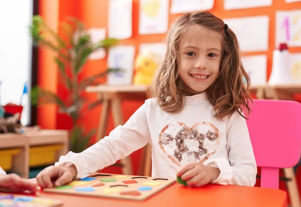 Adorable Hispanic Girl Playing Maths Puzzle Game Sitting Table Kindergarten — Stock Photo, Image
