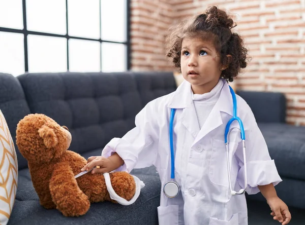Adorable Hispanic Girl Wearing Doctor Uniform Holding Measuring Temperature Home — Stock Photo, Image