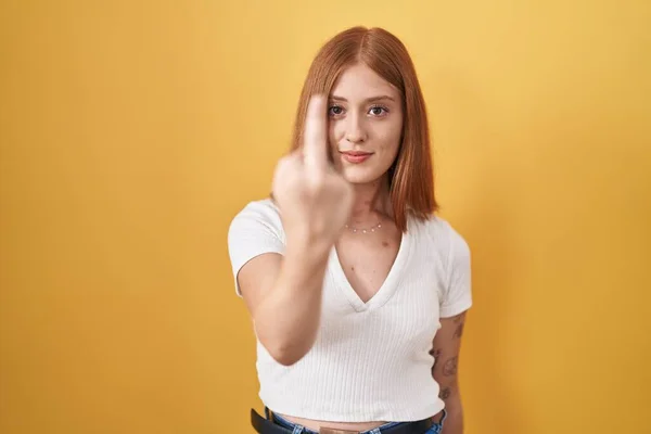 Young Redhead Woman Standing Yellow Background Showing Middle Finger Impolite — Foto de Stock