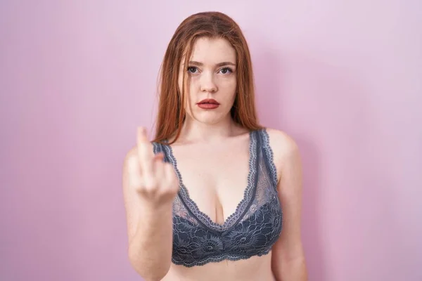 Redhead Woman Wearing Lingerie Pink Background Showing Middle Finger Impolite — Stockfoto