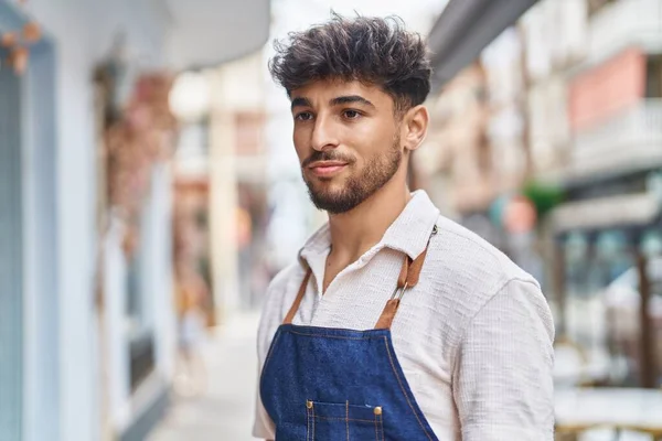 Young Arab Man Waiter Looking Side Serious Expression Restaurant — Φωτογραφία Αρχείου