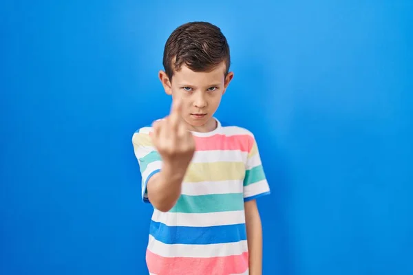 Young Caucasian Kid Standing Blue Background Showing Middle Finger Impolite — Zdjęcie stockowe